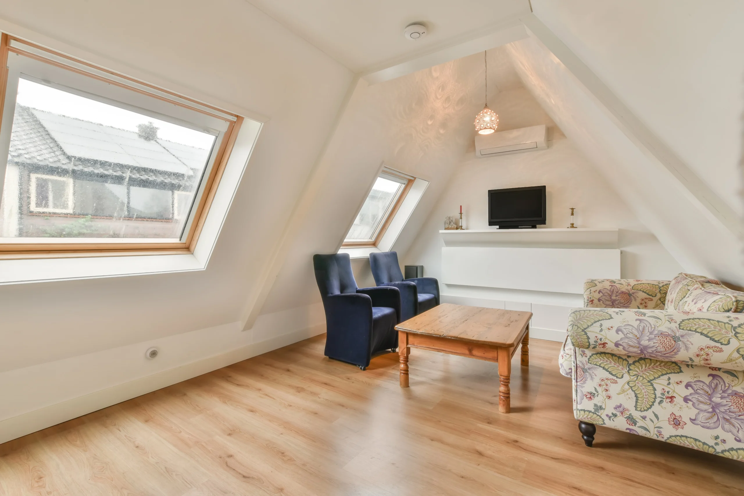 charming attic living room with natural light cozy atmosphere scaled Zolderverbouwing