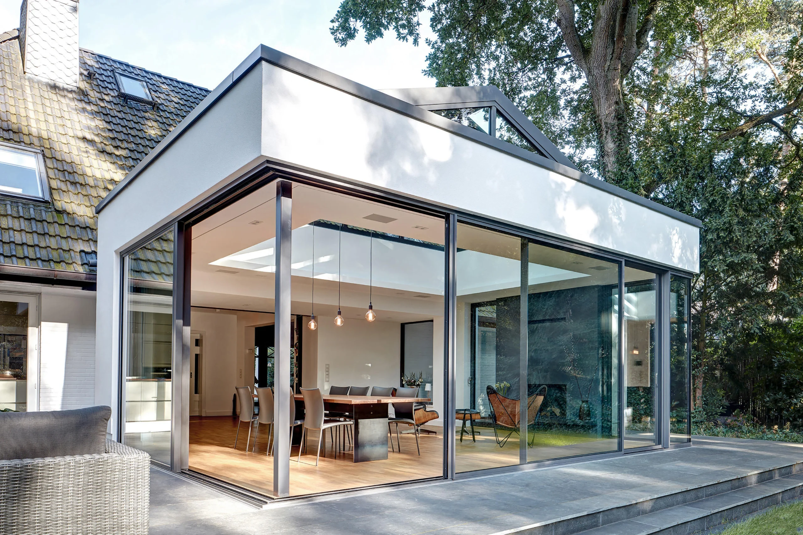 modern glass house extension with open plan living garden view scaled Aanbouw